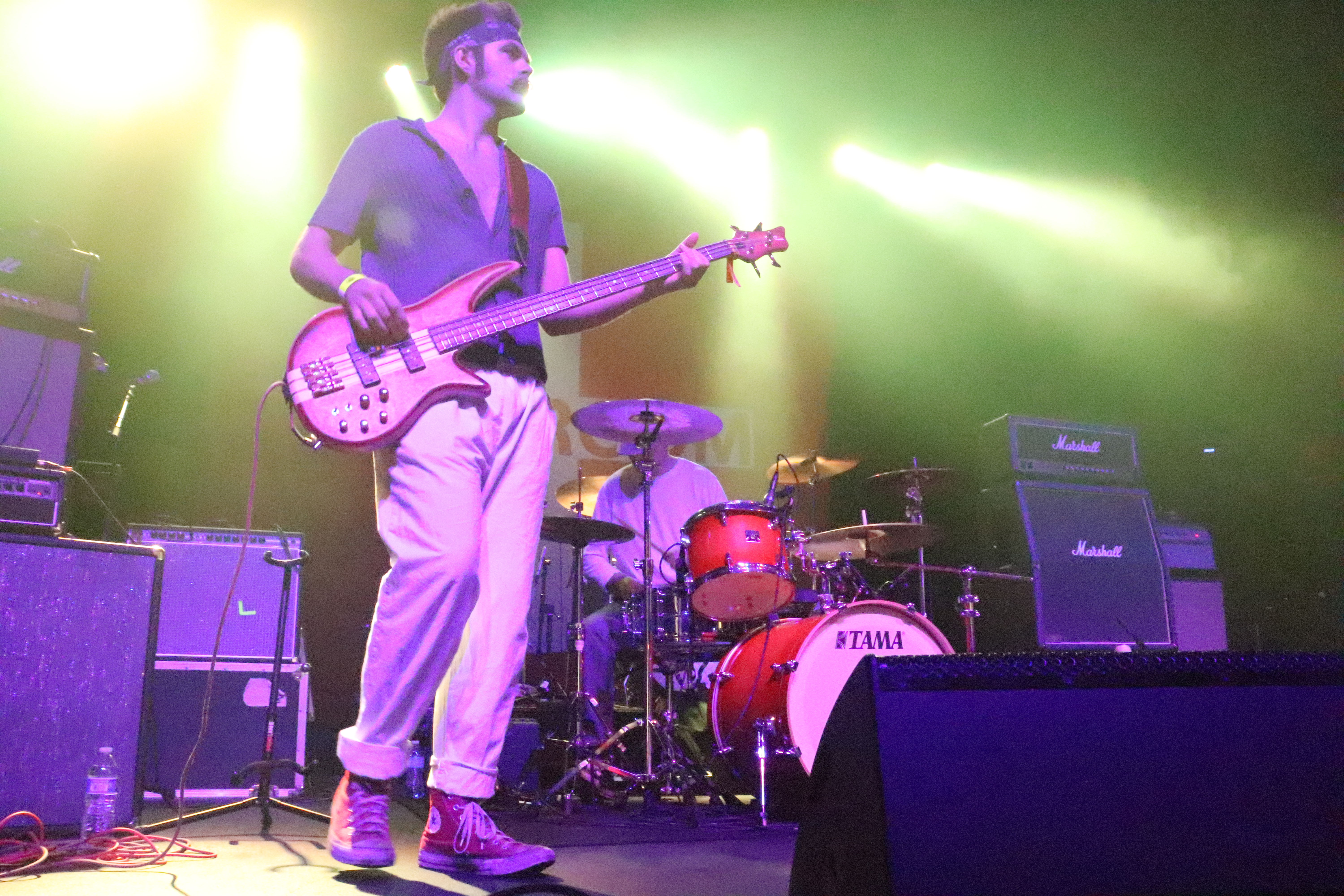 Band from crowd under purple lights